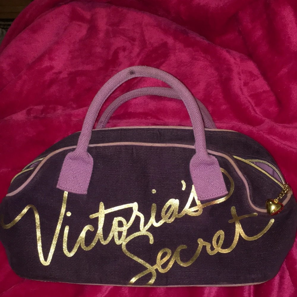 A purple and gold Victorious secret bag